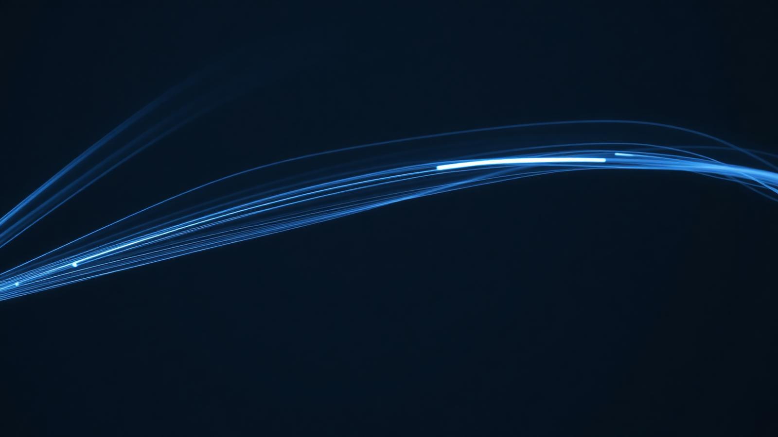 Fibre optic strands glowing against a dark background